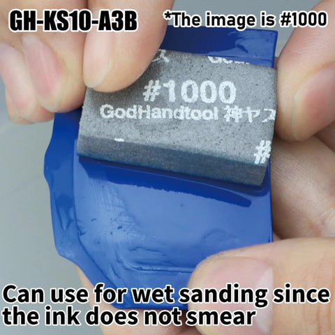Close-up of Sanding Sponge Set 34P 10mm Thick Wet Dry Assorted Grits 120 To 10000 for Models in use on blue surface.