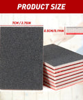 Front view of a 24-piece sanding sponge set, black abrasive surface with white core; 7 cm by 10 cm, 0.5 cm thick.