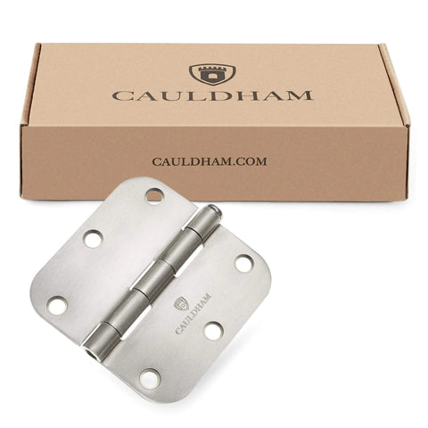 (12 Pack) Heavy-Duty 3-1/2" Interior Door Hinges with 5/8" Radius Corners - Satin Nickel next to Cauldham packaging