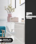 Room with black door featuring Dummy Lever Door Handles 2 Pack For Closet And French Doors, satin nickel finish, slim square non turning design.