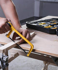 Man using yellow hacksaw with 228 Piece Socket Wrench Auto Repair Tool Set With Mixed Hand Tools In Durable Plastic Toolbox