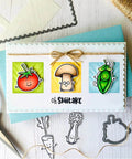 Greeting card with cartoon tomato, mushroom, and pea on scalloped frame with twine, scissors, and cutting dies for DIY crafts