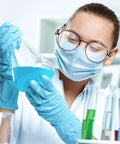 Scientist wearing Slip On Safety Glasses Side Shields 2 Pairs Transparent Anti Slip Protectors while handling lab liquids