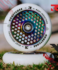 110mm Pro Scooter Wheels Pair White Rocket Fuel with Bearings Installed on grass, showcasing lightweight and durable design