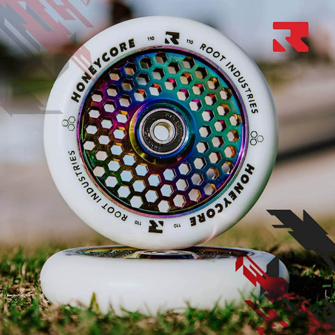 110mm Pro Scooter Wheels Pair White Rocket Fuel with Bearings Installed on grass, showcasing lightweight and durable design