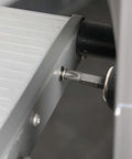 Close-up of stainless steel screw from Nuts And Bolts Assortment Kit 900 Pcs being installed into metal frame.