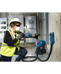 Person using One And One Eighth Inch SDS-Plus Bulldog Xtreme Max Rotary Hammer For Concrete Drilling And Chiseling In Masonry