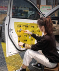 Person using Pro Grade Seam Roller Hand Roller With Anti Slip Ergonomic Steel Roller on car door sound deadening material