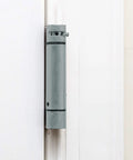 Self Closing Slim Spring Hinges Four And A Half Inch By Four And A Half Inch Set Of 3 for medium and heavyweight metal or wood doors, installed view.