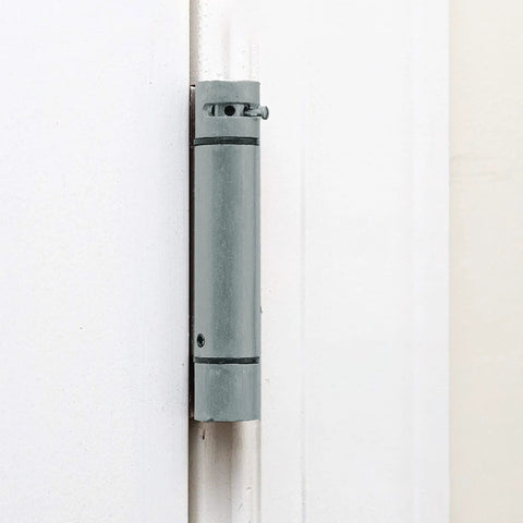 Self Closing Slim Spring Hinges Four And A Half Inch By Four And A Half Inch Set Of 3 for medium and heavyweight metal or wood doors, installed view.