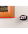 Effortlessly align pictures, shelves, and mirrors with this self-leveling 360-degree laser level and wall mount on wall