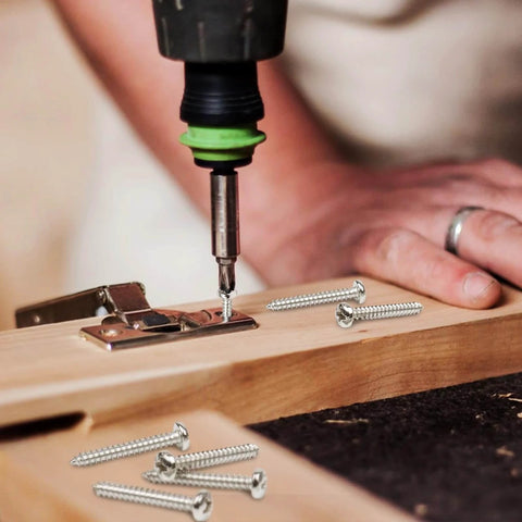 Person using a drill with 100 Pcs #6 x 1 Inch Pan Head Wood Screws Made from 304 Stainless Steel for wood installation.