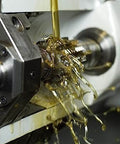Trinity Cool XM3 Gates Engineered Lubricants Pro Grade High Performance Semi Synthetic Metalworking Fluid in use, close-up view.
