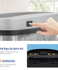 Pressing button on 13 Gallon Sensor Trash Can With Lid Automatic Touchless Garbage Can Odor Control Modern Oval Design