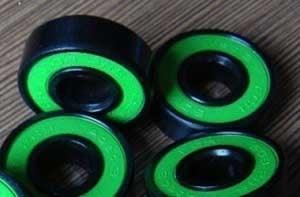 Set of 8 Skateboard Black Bearings with Bronze Cage and green Seals 8x22x7mm - VXB Ball Bearings