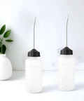 Front view of Two Pack 120ml Sewing Machine Oil Can Set with precision long nozzle, suited for household and industrial equipment care.