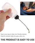 Hand holding Three Piece Sewing Machine Oil Can Set With Iron Spout And Cap For Precise Lubrication On Sewing Machines