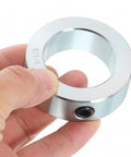 Close-up of Four Piece Set Screw Shaft Collars By Uxcell, one and a half inch bore, zinc plated heavy duty carbon steel for linear rod guides.
