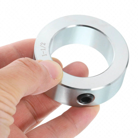Close-up of Four Piece Set Screw Shaft Collars By Uxcell, one and a half inch bore, zinc plated heavy duty carbon steel for linear rod guides.