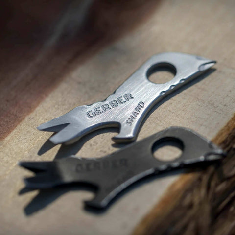 Shard 7 In 1 Keychain Multitool With Bottle Opener And Screwdriver, Lightweight Stainless Steel EDC Tool, close-up on wooden surface