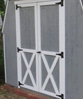 Gray storage barn with double doors fitted with black shed door latch T handle lock kit