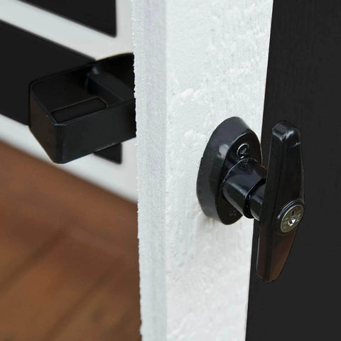 Shed door latch T handle lock kit with 4 keys, heavy duty metal hardware, black finish, side view on white wooden door