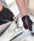 Person using Sheet Metal Bender And Hand Seamer 3 Inch Alloy Steel Straight Jaw Tool on metal edge, wearing gloves for safety.