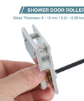 Hand holding Frameless Sliding Shower Door Roller Replacement Set With Aluminum Alloy Flat Edge Wheels 26mm Diameter For 8 To 10mm Thick Glass Silver Finish Durable 2 Pack For Bathroom Glass Doors Easy Install And Smooth Operation
