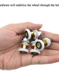 Hand holding 20mm diameter brass shower door wheels with nylon rollers, stainless steel screws, and ball bearings for easy install.