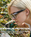 Person gardening wearing over glasses safety goggles anti fog ANSI Z87 eye protection with side shields for enhanced safety.