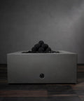 12-Pack Black Ceramic Fire Balls in modern fire pit for outdoor decorative use