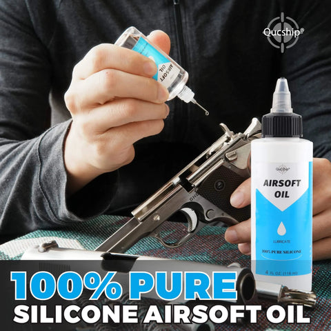 Person applying Airsoft Oil 4 oz & 1 oz Needle Oiler 100% Silicone Air Gun Oil on airsoft gun, showing both bottle sizes.