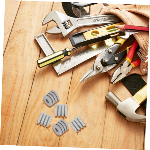 Silicone Antiskid Pads Set 20 Pack Non Slip Bumpers For Chassis And Furniture Feet next to tools on wooden background