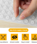 Clear Self Adhesive Cabinet Bumpers For Kitchen Cabinets And Doors, Silicone Noise Reduction Cushions being applied by hand