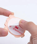 Soft Silicone Doorknob Cushion Wall Protector And Anti Collision Stopper being peeled by hand to reveal adhesive backing.