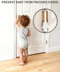 Christmas Tree Hanging Silicone Door Pinch Guard And Anti Door Slam Stopper Set For Baby Proofing Homes Keeps Doors Open And Fingers Safe With Hidden Hinge Mount Kid Safe And Easy To Install 2 Pack White shown on door hinge with toddler nearby