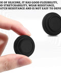 Hand holding silicone door shock absorber pad, with another pad in view; durable, wear-resistant, self-adhesive for cars.