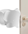 Soft silicone door wall protector cushions every swing to prevent scuffs, 8 cm diameter, installed on a door handle