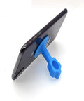 Silicone Door Stopper Bumper Pad And Wall Protector For Soft Closing Doors And Cabinets Reduces Noise And Impact Protects Walls Provides Gentle Cushioning And Easy Mounting With Suction Cup For Tile Surfaces And Handy Phone Holder shown supporting a phone.