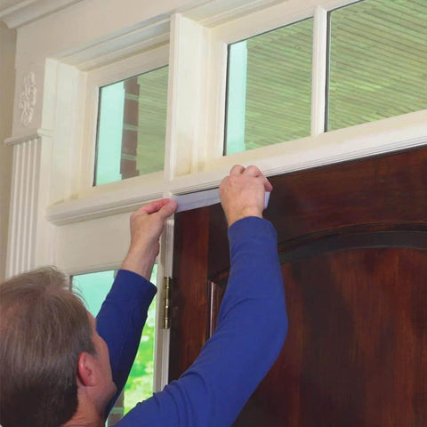 Person installing Alien Draft Seal Set of 49 Feet Anti-Draft Adhesive and Flexible Flap to Seal Gaps Around Doors and Windows As Seen On TV