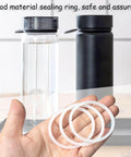 Hand holding 6 Pack Water Bottle Gasket Replacements For Wide Mouth Flip Lids, Silicone O Rings And Seals, 57mm Outer Diameter