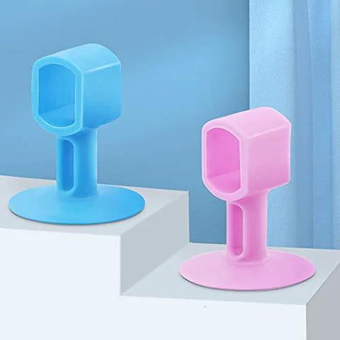 Two silicone pad stoppers, blue and pink, displayed on steps, for doors and cabinets anti-collision, enhancing home quietness.