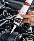 Applying Beefy High Temp Silicone Gasket Maker Black Sealant For Automotive Motorbike And Machinery 13 Oz Tube on engine part