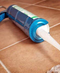 Clear Electronic Grade Silicone Sealant and Adhesive, 10.2 Oz Cartridge with nozzle, shown on tiled surface, Moisture Cure RTV