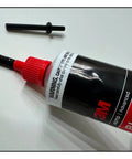 Anti-Clog Dispenser Caps For RTV Silicone Sealant 3oz Flexible Tubes, Reusable Sealer Caps in use on black silicone tube