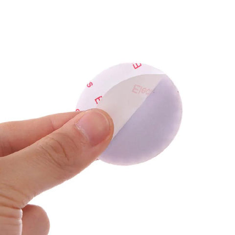Close-up of a pink silicone self-adhesive wall protector being peeled, part of a 5 Piece Silicone Self Adhesive Wall Protectors For Door Handles And Doorknobs Pink Cushioning Bumpers Buffer Guards And Silencers To Prevent Scratches Noise And Crashes In Home And Office set