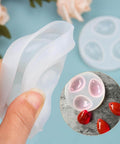Close-up of Water Drop Pendant Silicone Molds For Resin Casting Jewelry Making 2 Pack With Hole Easy Release and red resin pendants.