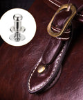 4mm Ball Head Stud Rivets With Screw Back on brown leather bag closure, showcasing silver tone zinc alloy rivet details, 15 pack.