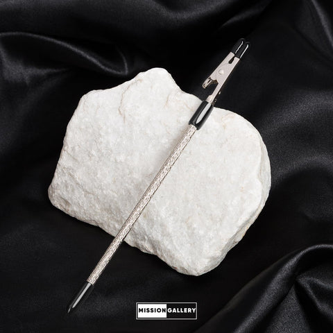 Bracelet Fastener Helper Tool For Easy On Jewelry Clasp Clip For Bracelets Necklaces And Watches Portable Metal Silver Life Saver No Slip Grip And User Friendly Design on white rock background