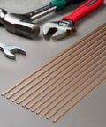 BCuP-5 15% Silver Brazing Rods, 0.050 x 1/8 x 10 Inches arranged with hand tools for HVAC welding